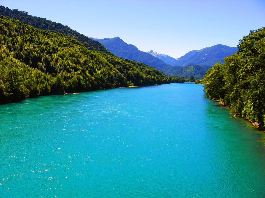 Turquoise river between forested hills, in Puelo